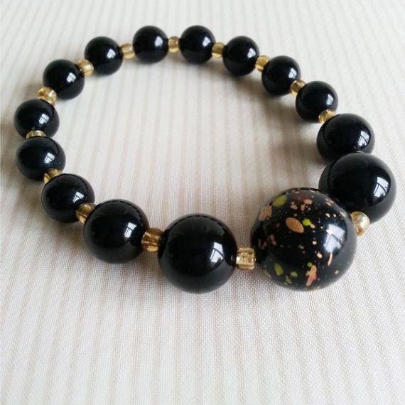 Black and Amber coloured elasticated bead bracelet